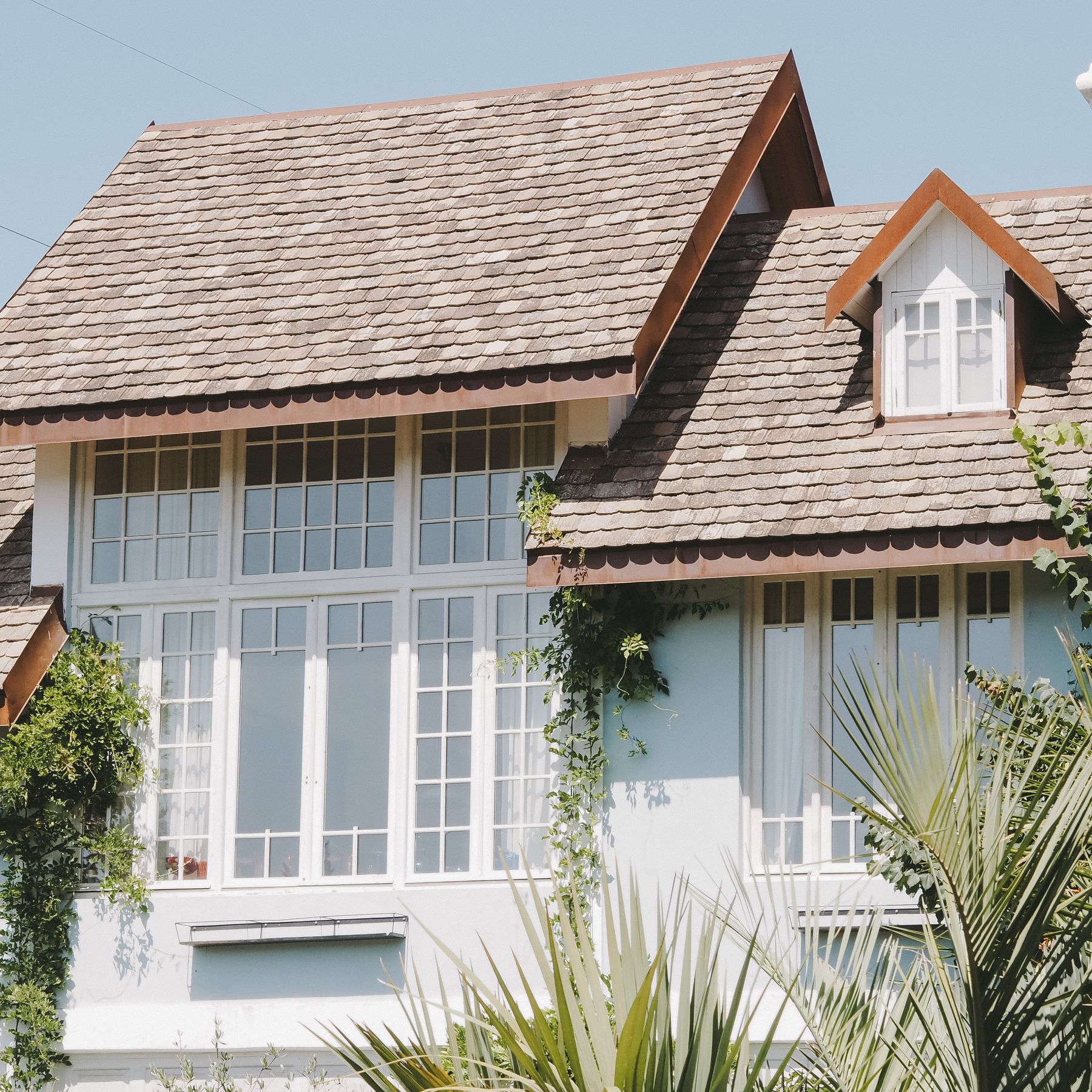 Close view of a pitched roof and its shingle pattern